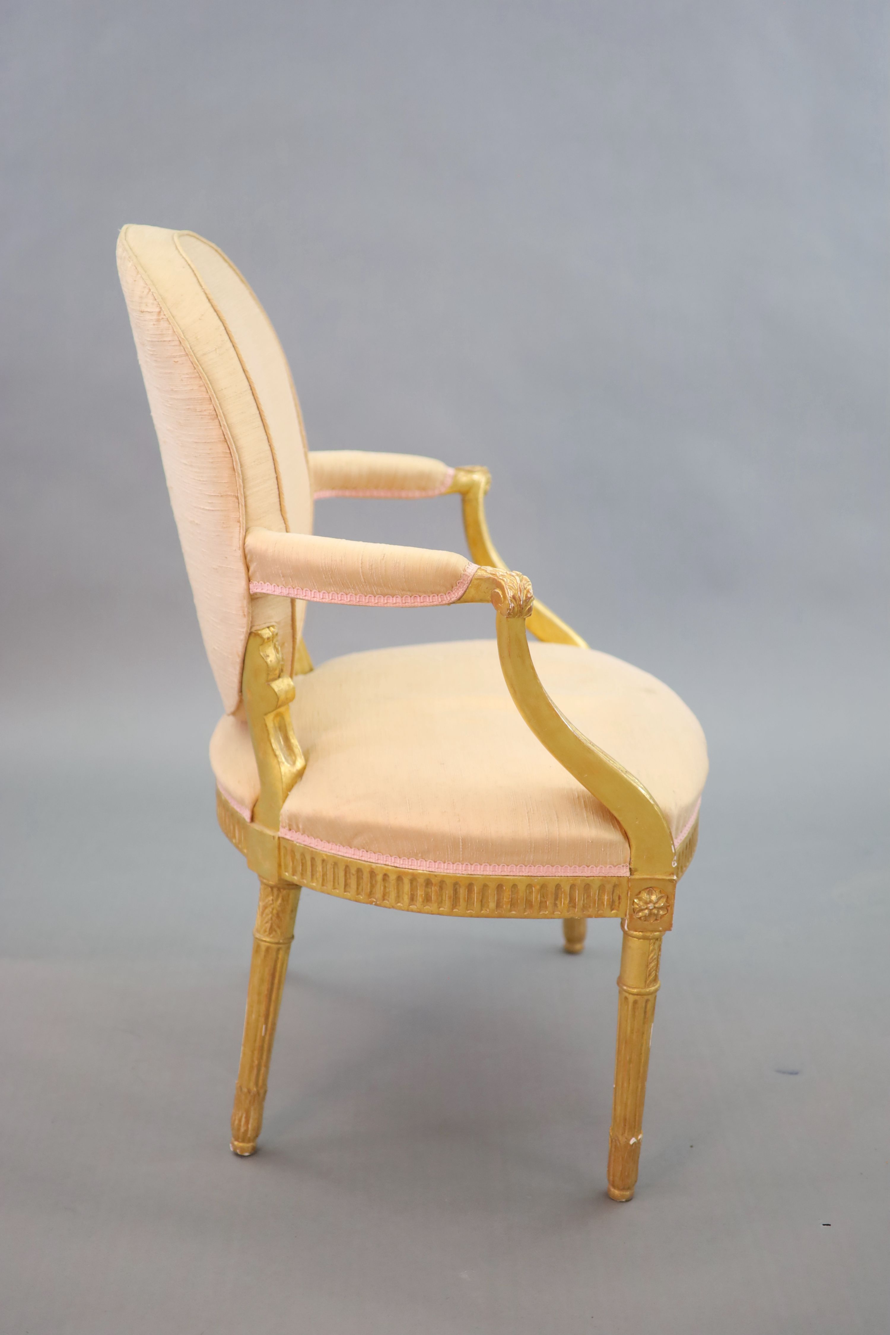 A George III giltwood open armchair, W.64cm H.90cm D.60cm